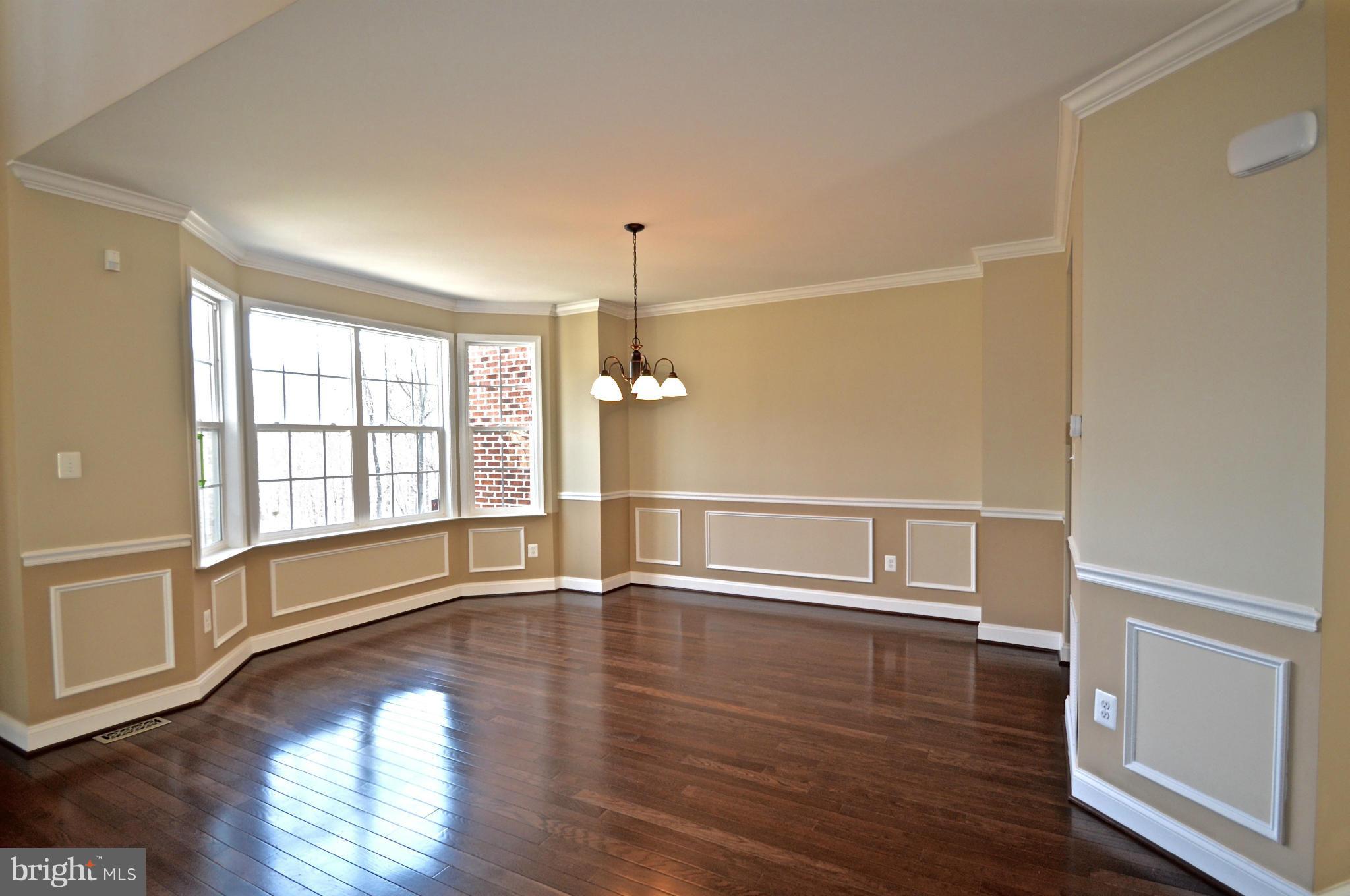 6659 South Clifton Road Frederick, MD 21703 - Photo 5 of 30 wooden floor in an empty room with a window