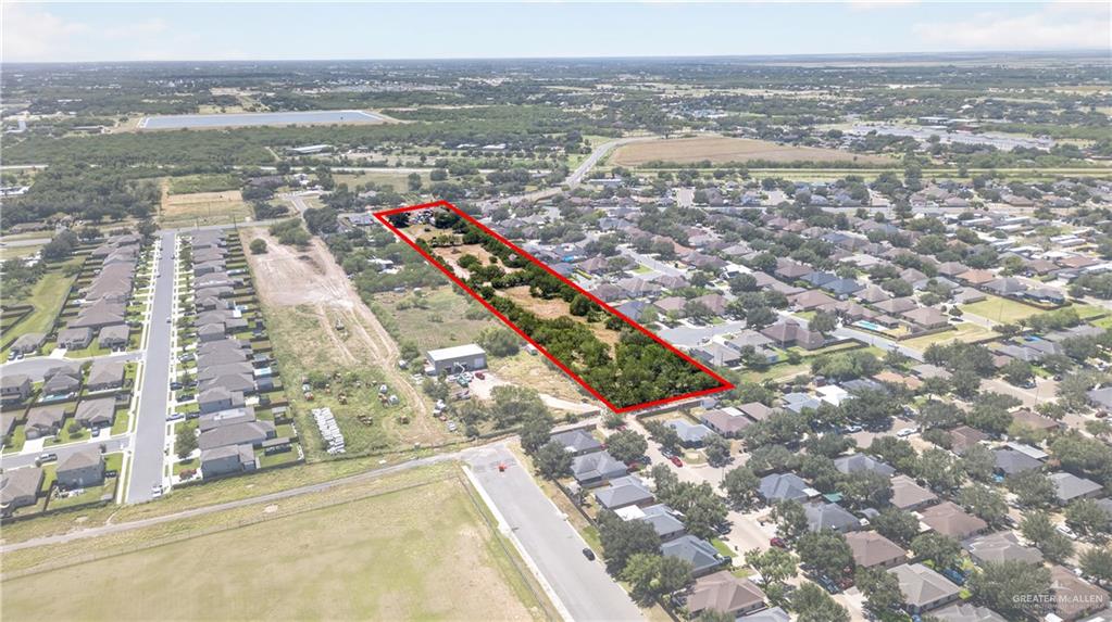 8900 North Ware Road McAllen, TX 78504 - Photo 8 of 13 Expansive rectangular lot featuring established trees and surrounding residential development