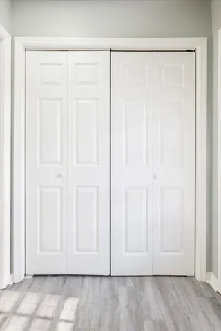 an empty room with wooden floor