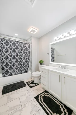 a bedroom with bed and a window