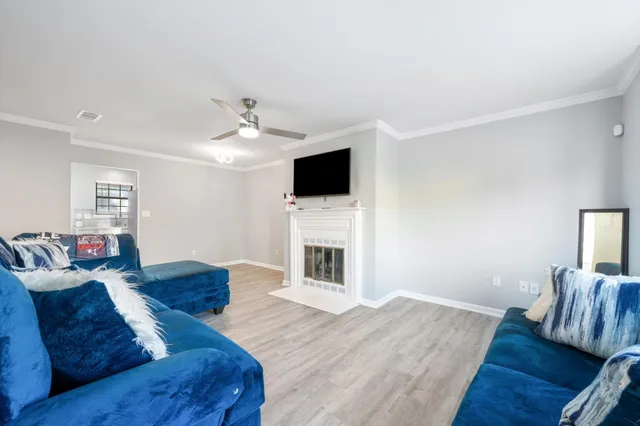 a living room with furniture and a fireplace