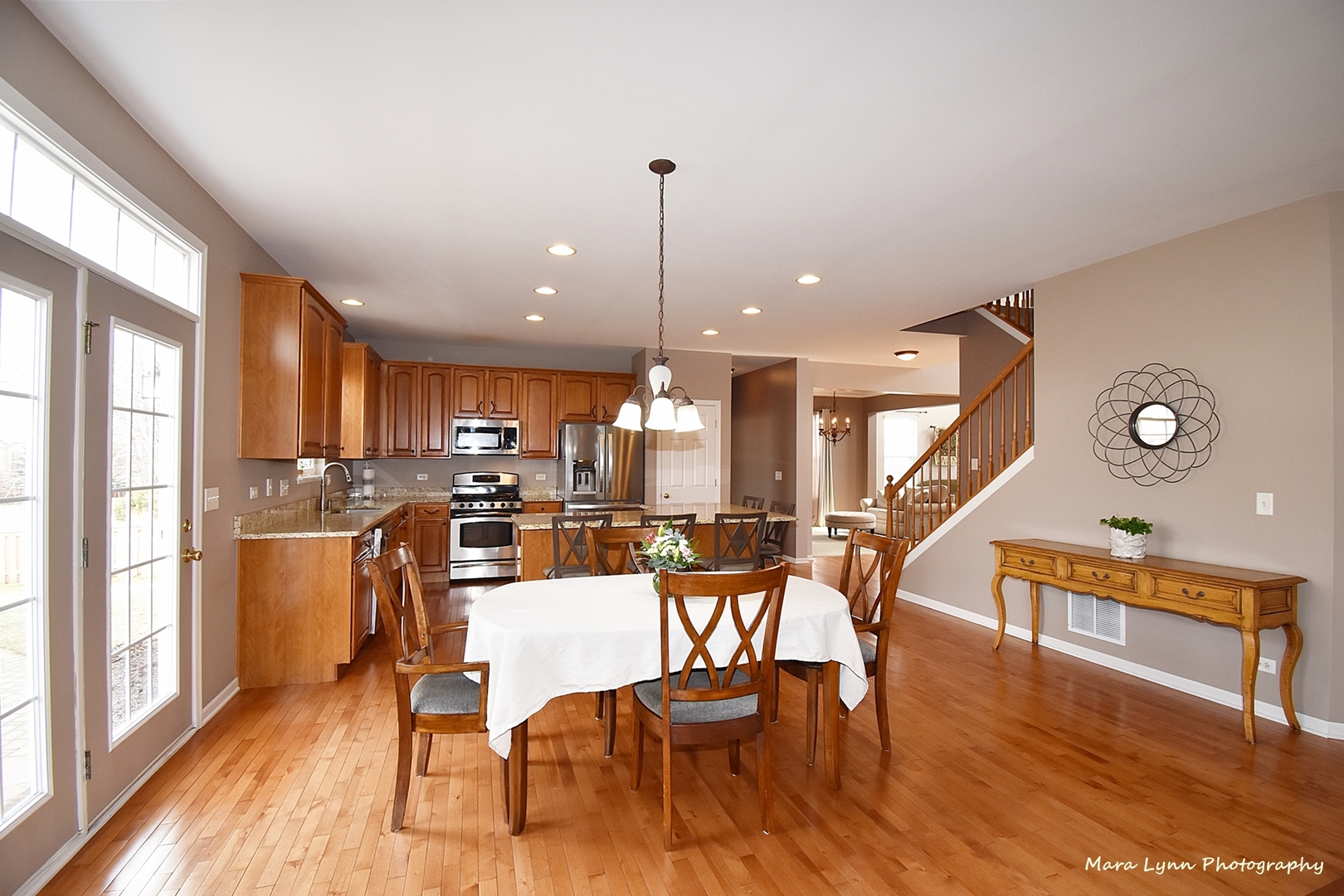 294 Sonora Drive Elgin, IL 60124 - Photo 13 of 40 a dining room with furniture a chandelier and wooden floor