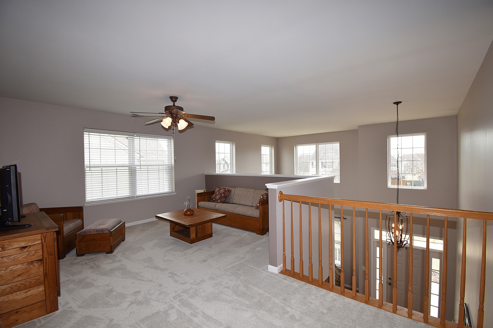 294 Sonora Drive Elgin, IL 60124 - Photo 22 of 40 a living room with furniture a chandelier and a window