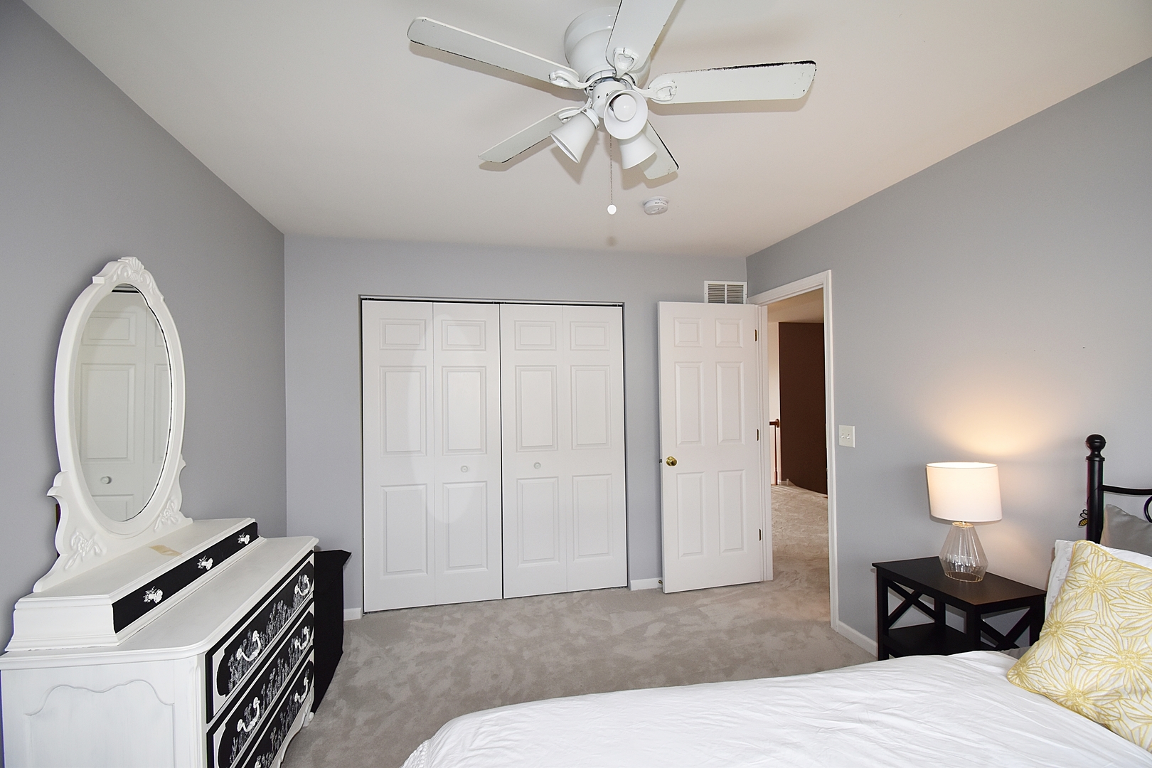 294 Sonora Drive Elgin, IL 60124 - Photo 29 of 40 a bedroom with a bed and a chandelier