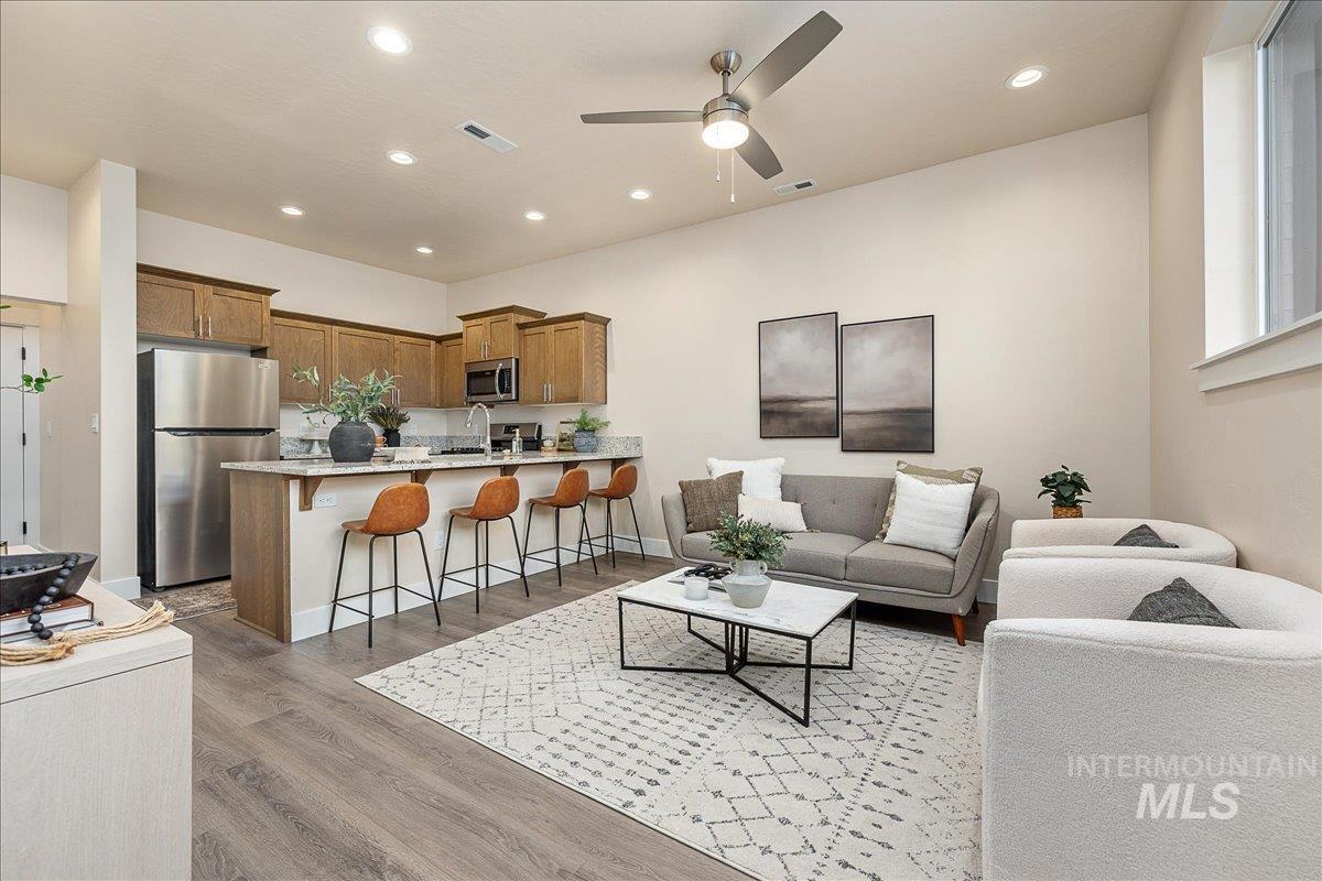 1445 North Bluffs Ridge Lane Boise, ID 83704 - Photo 3 of 47 Living area featuring light wood-type flooring, ceiling fan, and recessed lighting