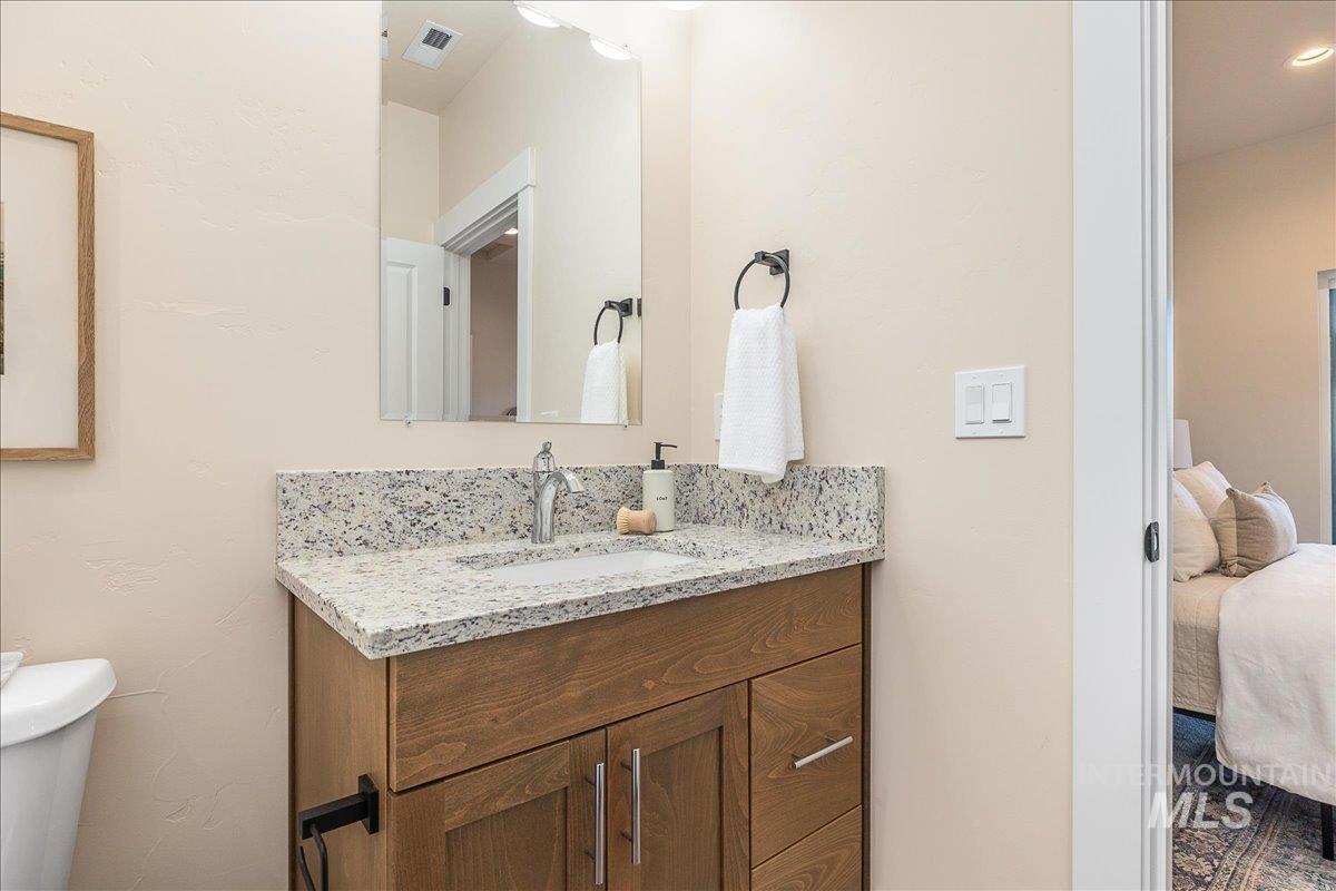 1445 North Bluffs Ridge Lane Boise, ID 83704 - Photo 38 of 47 Ensuite bathroom with vanity and toilet