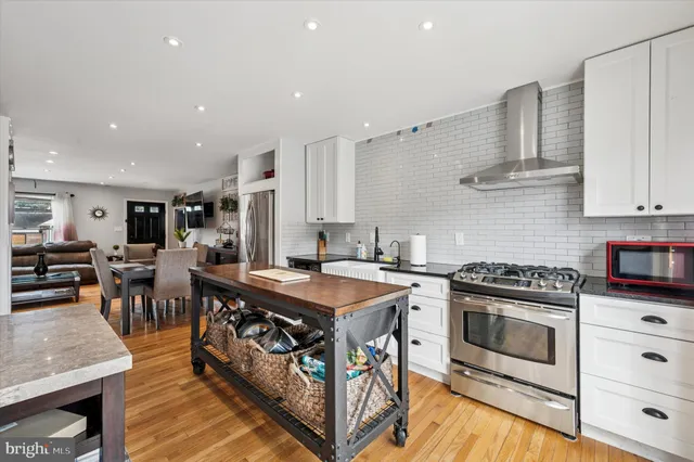 a kitchen with a stove and a refrigerator