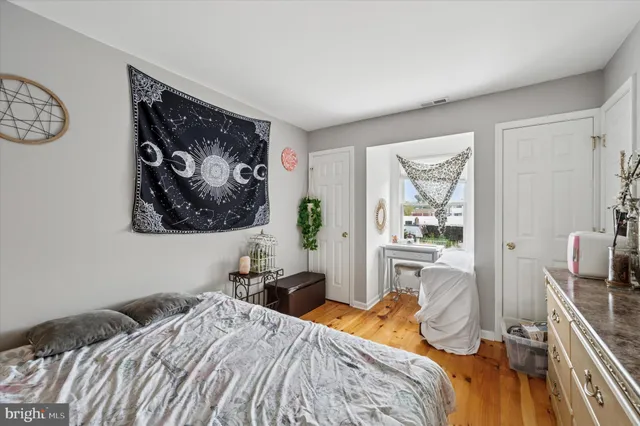 a bedroom with a bed and a table in it