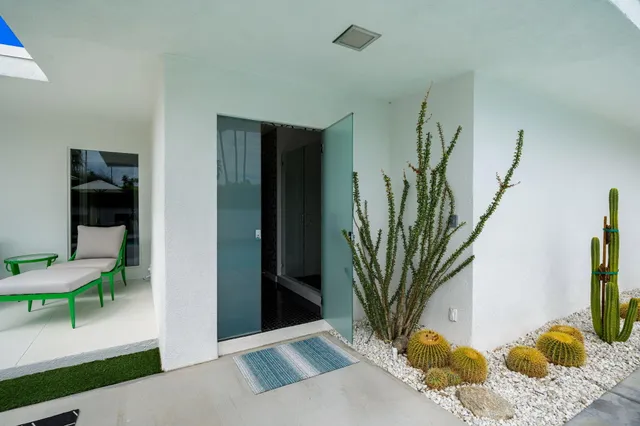 a view of a swimming pool with a lounge chairs