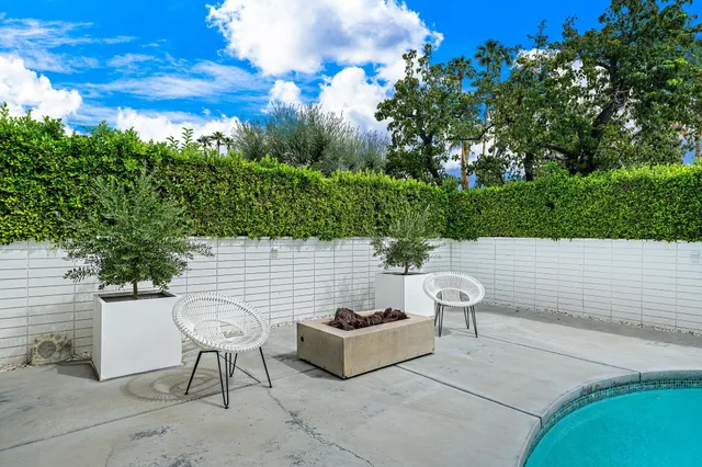 a view of a livingroom with furniture and a flat screen tv
