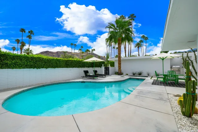 a bedroom with furniture and a fireplace