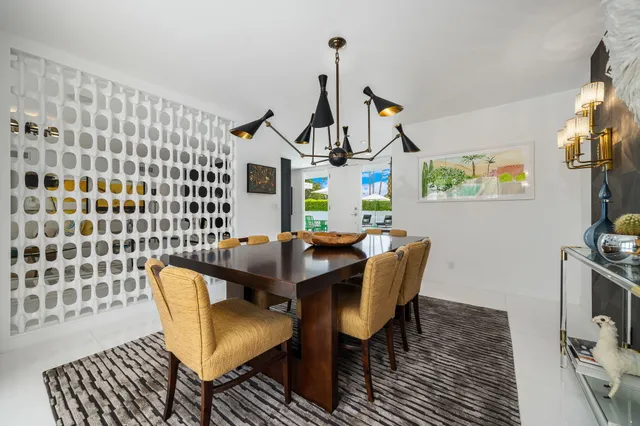 a kitchen with stainless steel appliances a sink stove and cabinets