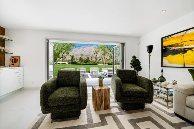 a bathroom with a sink mirror vanity and toilet