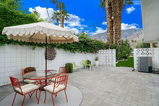 a spacious bedroom with a bed and a couch