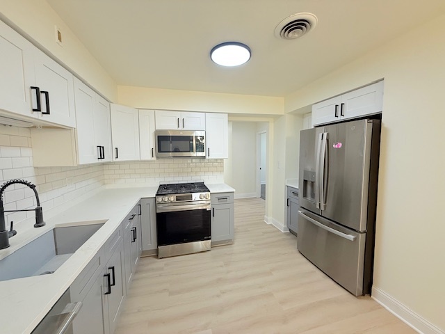 833 Heritage Drive, Unit 1 Addison, IL 60101 - Photo 5 of 14 a kitchen with granite countertop a refrigerator stove and sink
