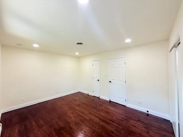 a view of room with wooden floor and window