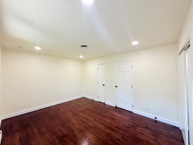 833 Heritage Drive, Unit 1 Addison, IL 60101 - Photo 7 of 14 a view of room with wooden floor and window