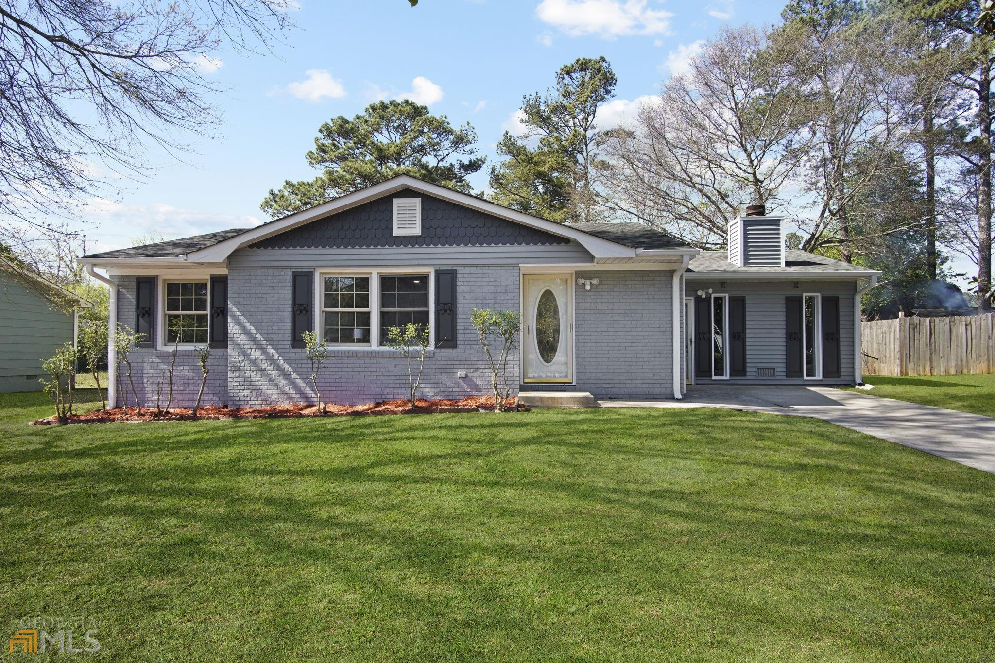 1686 Kinglet Road Hampton, GA 30228 - Photo 1 of 1 front view of a house with a yard