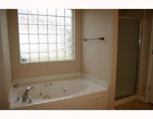 a bathroom with a tub and a sink
