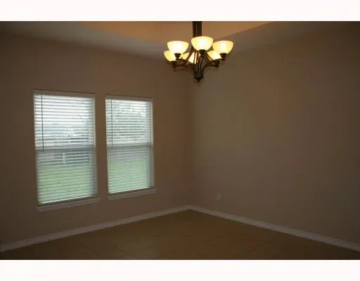 a view of a windows and chandelier in a room