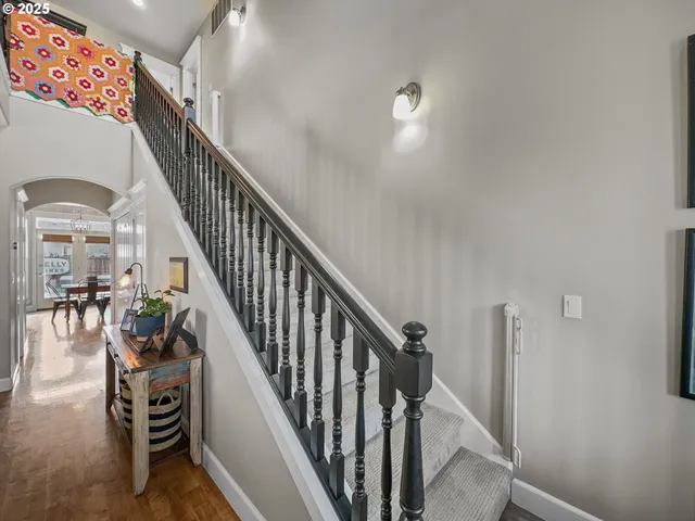 a view of a livingroom with furniture and stairs