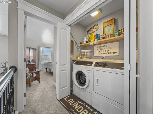 a bedroom with a bed and large window