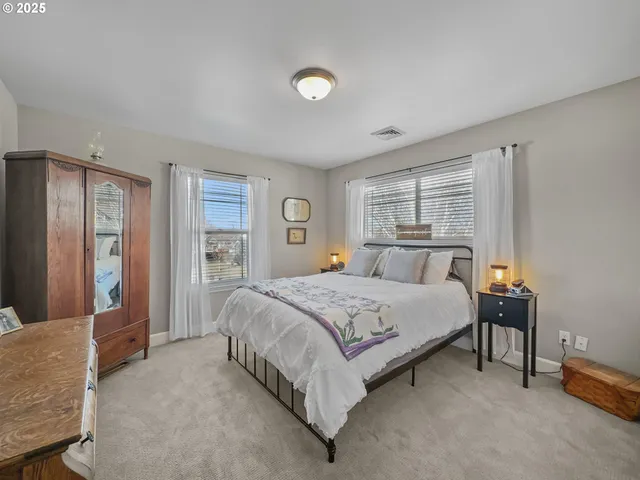 a bedroom with a bed and a television