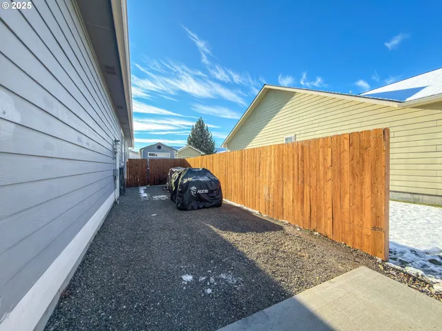 a house view with a backyard space