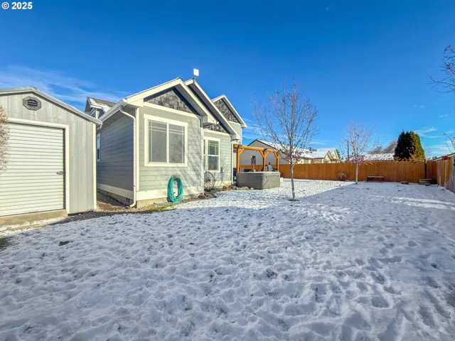 a patio with sofas table and chairs