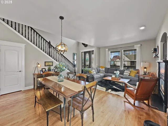 a living room with lots of furniture and a wooden floor
