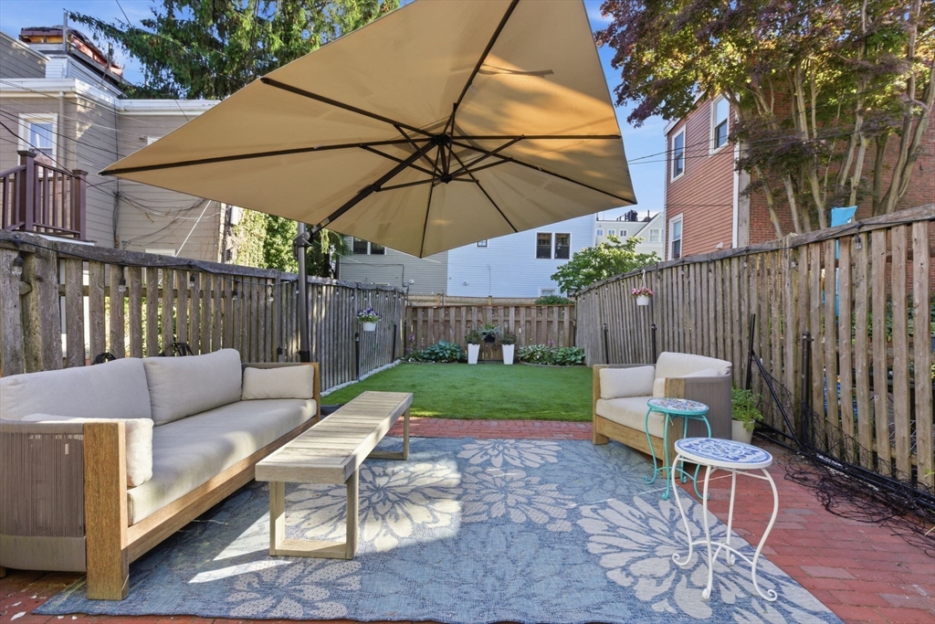 38 Bartlett Street Boston, MA 02129 - Photo 14 of 37 a view of a chair and table in the patio