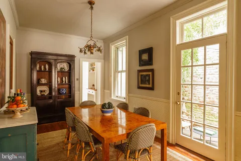 a kitchen with a sink and a stove top oven with granite countertops
