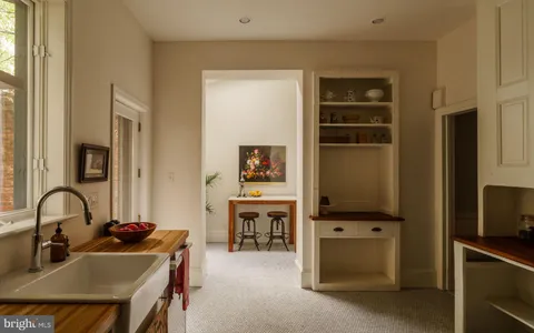 a view of living room with furniture and flat screen tv