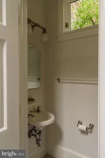 a view of backyard with table and chairs