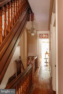 a living room with furniture cabinets and a window