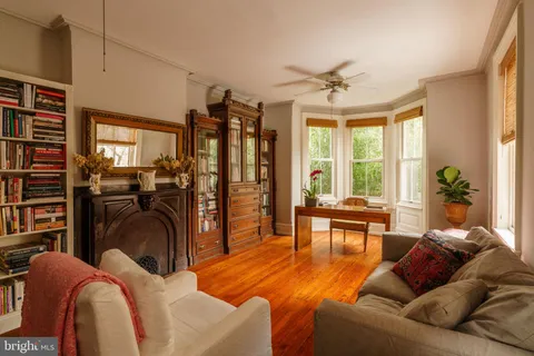a bathroom with a sink a mirror and a window