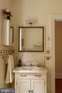 a bedroom with bed and a window