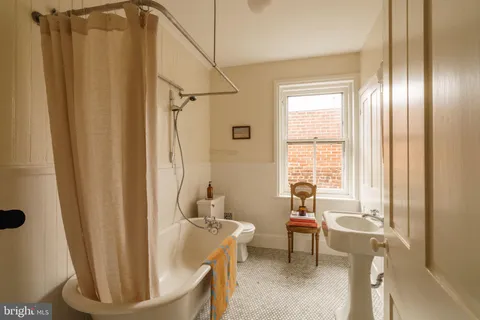 a bedroom with bed and window