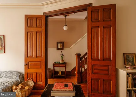 a living room with furniture a window and a chandelier