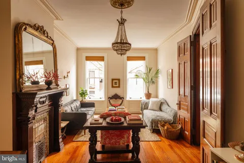 a living room with furniture and a gate