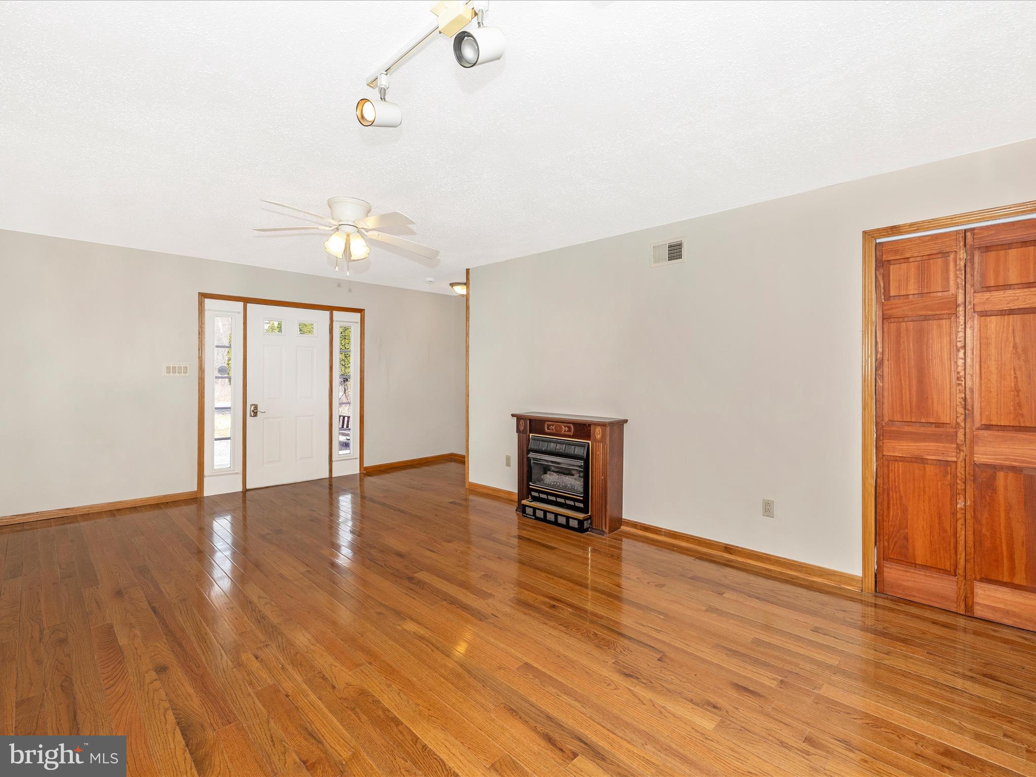 4439 John Draper Road Smithsburg, MD 21783 - Photo 11 of 63 an empty room with wooden floor and windows