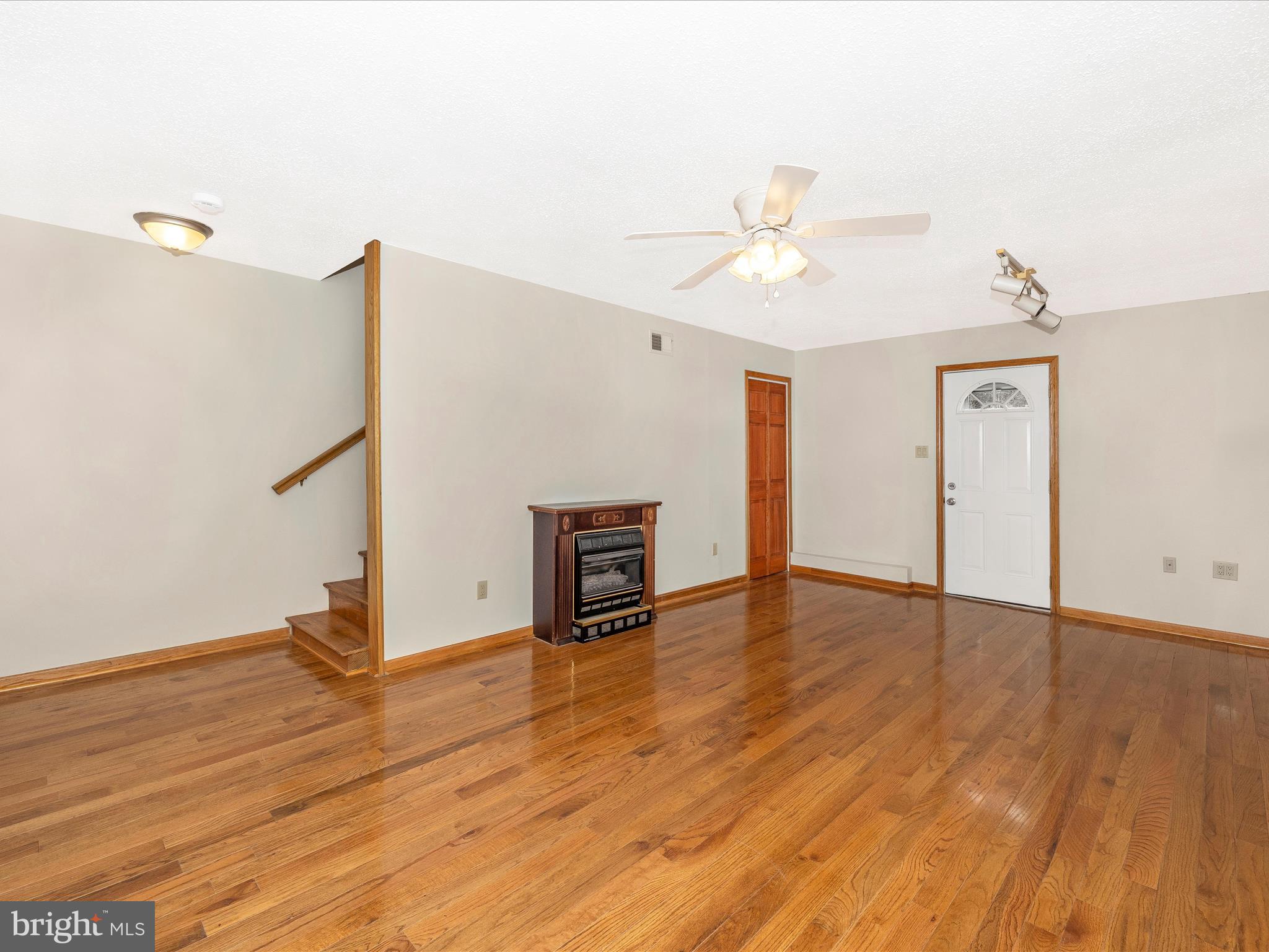4439 John Draper Road Smithsburg, MD 21783 - Photo 12 of 63 a view of empty room with wooden floor and fan