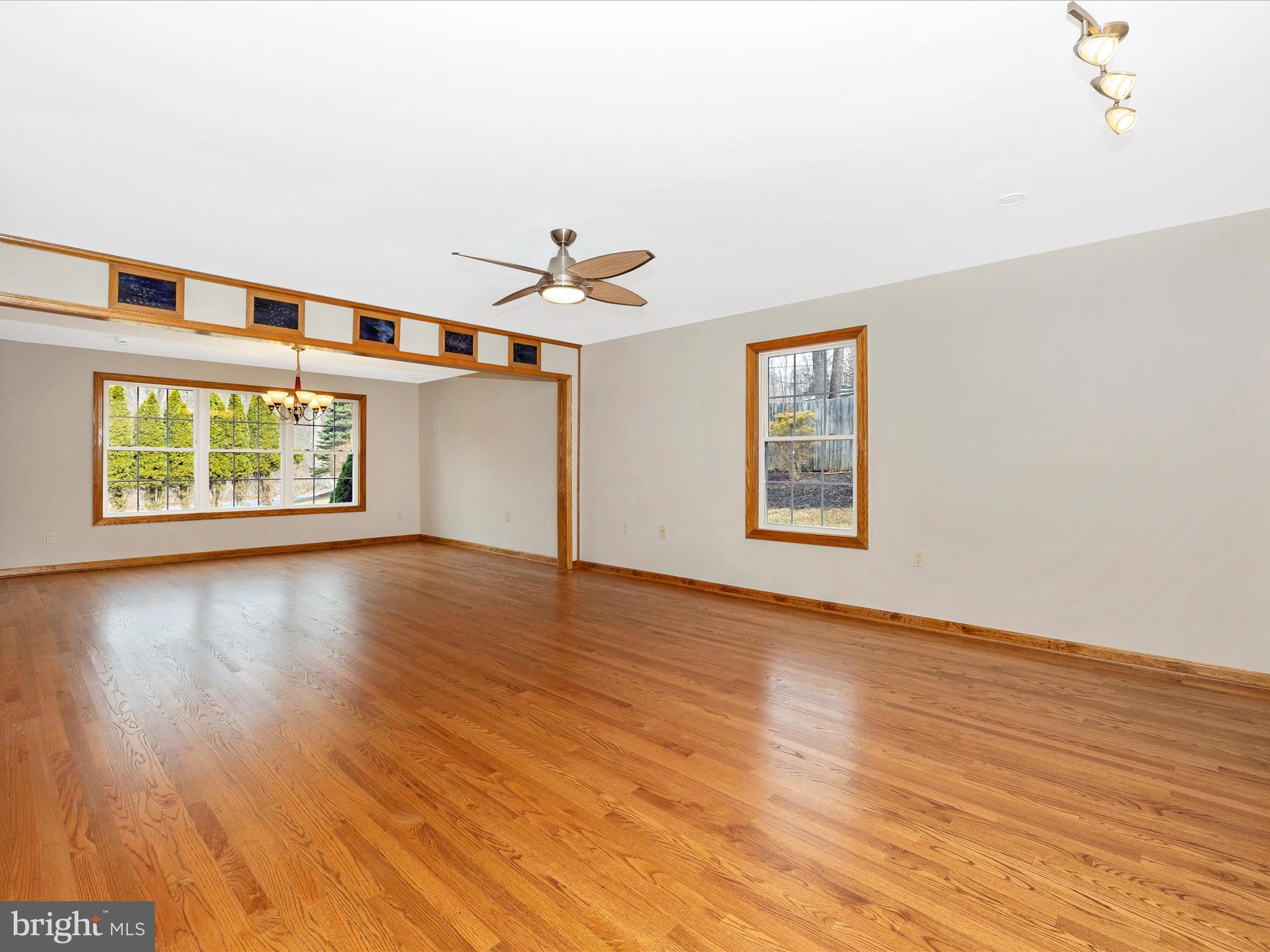 4439 John Draper Road Smithsburg, MD 21783 - Photo 25 of 63 an empty room with wooden floor chandelier and windows