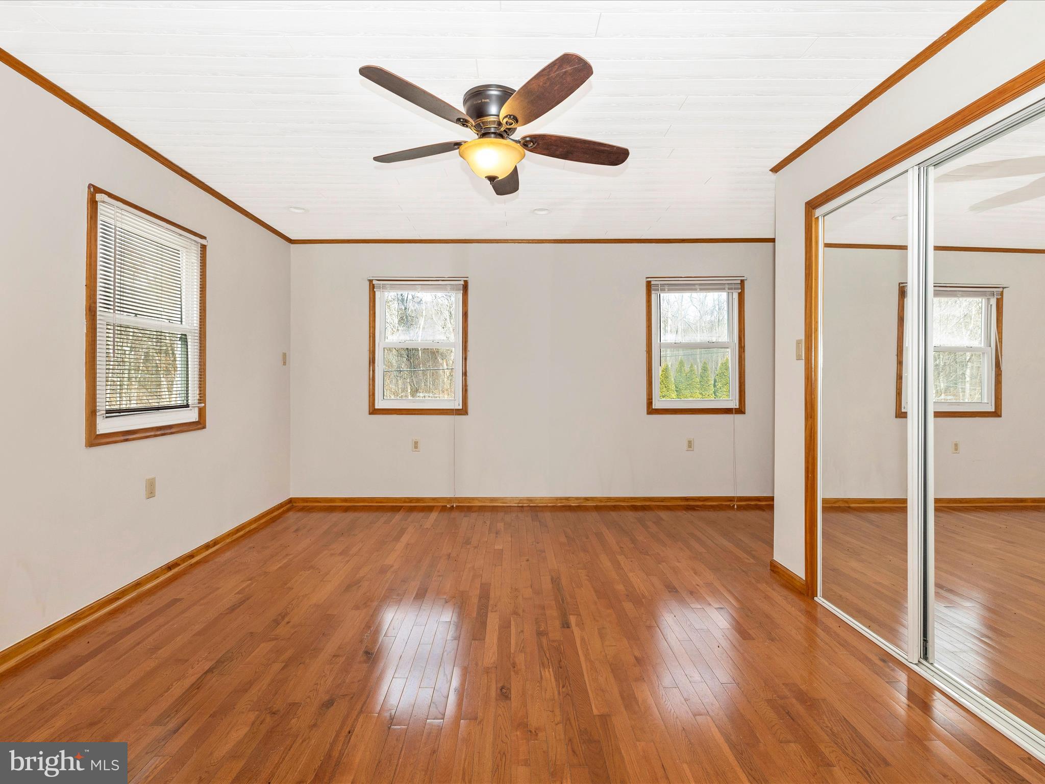 4439 John Draper Road Smithsburg, MD 21783 - Photo 29 of 63 a view of an empty room with wooden floor and a window