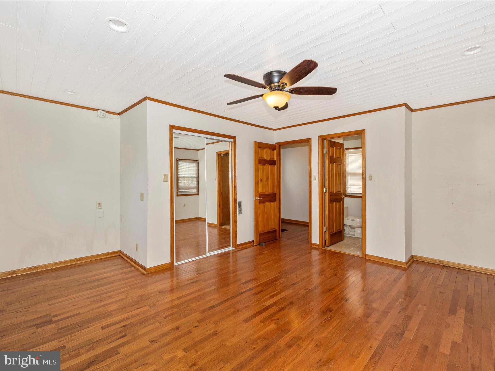 4439 John Draper Road Smithsburg, MD 21783 - Photo 32 of 63 a view of an empty room with window and wooden floor