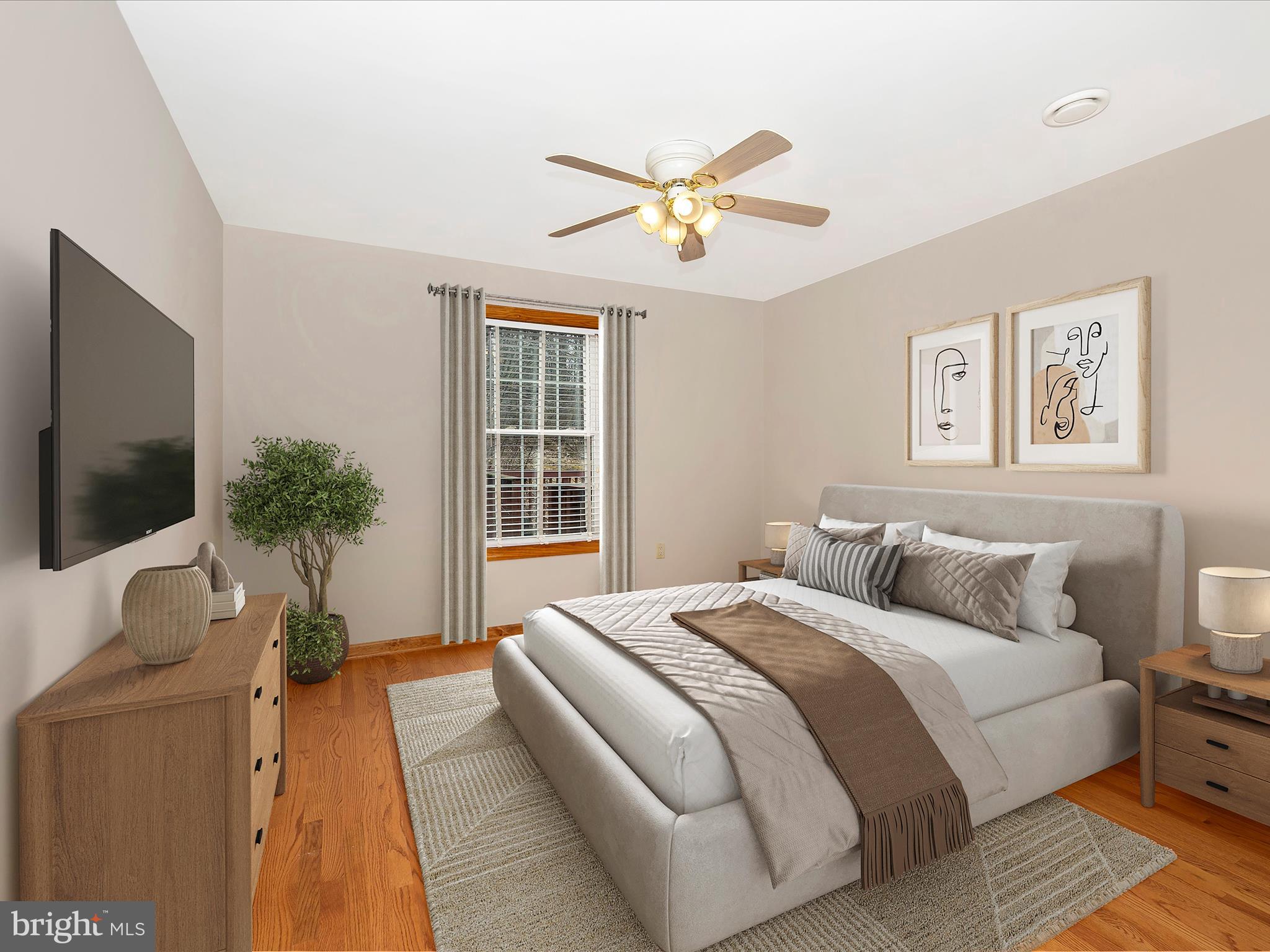 4439 John Draper Road Smithsburg, MD 21783 - Photo 36 of 63 a bedroom with a bed and a flat screen tv