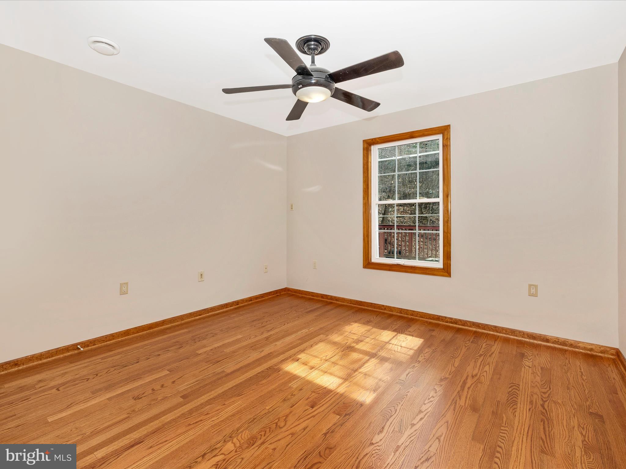 4439 John Draper Road Smithsburg, MD 21783 - Photo 41 of 63 a view of an empty room with wooden floor and a window