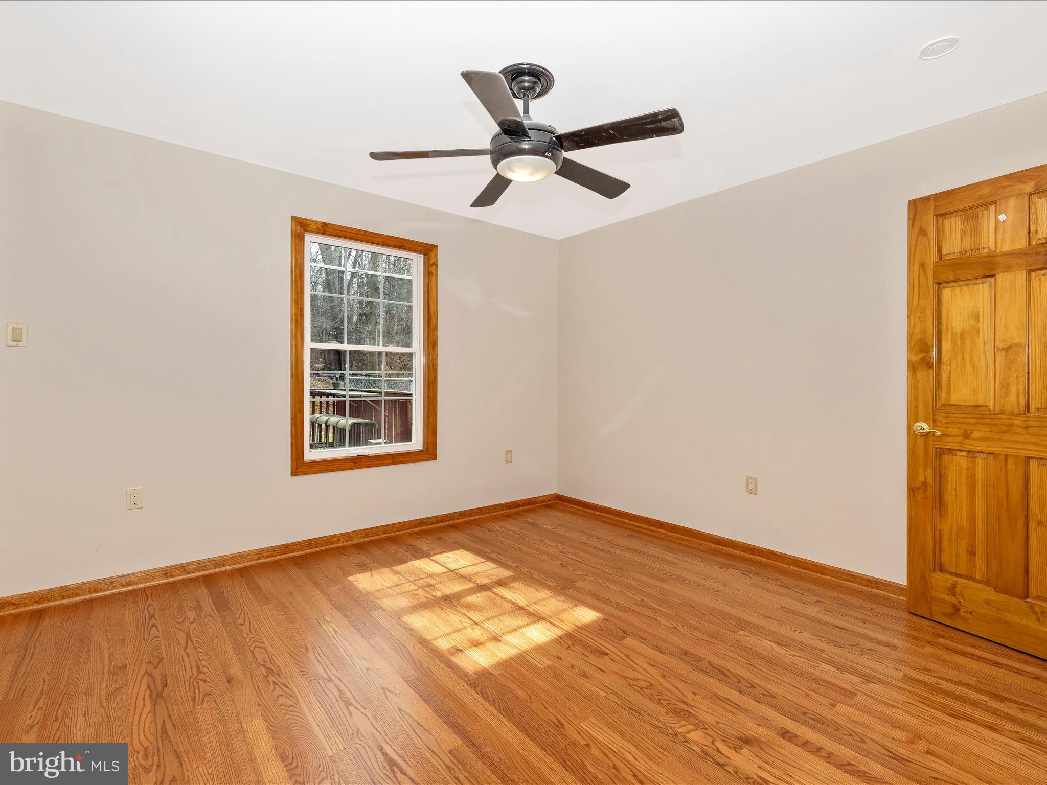 4439 John Draper Road Smithsburg, MD 21783 - Photo 43 of 63 a view of an empty room with wooden floor and a window
