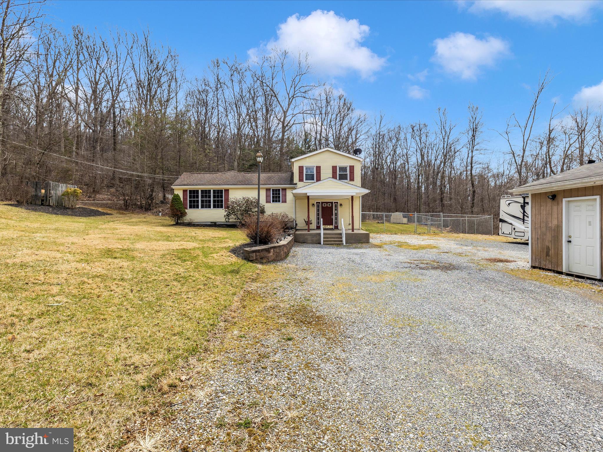 4439 John Draper Road Smithsburg, MD 21783 - Photo 51 of 63 a front view of a house with a yard and trees