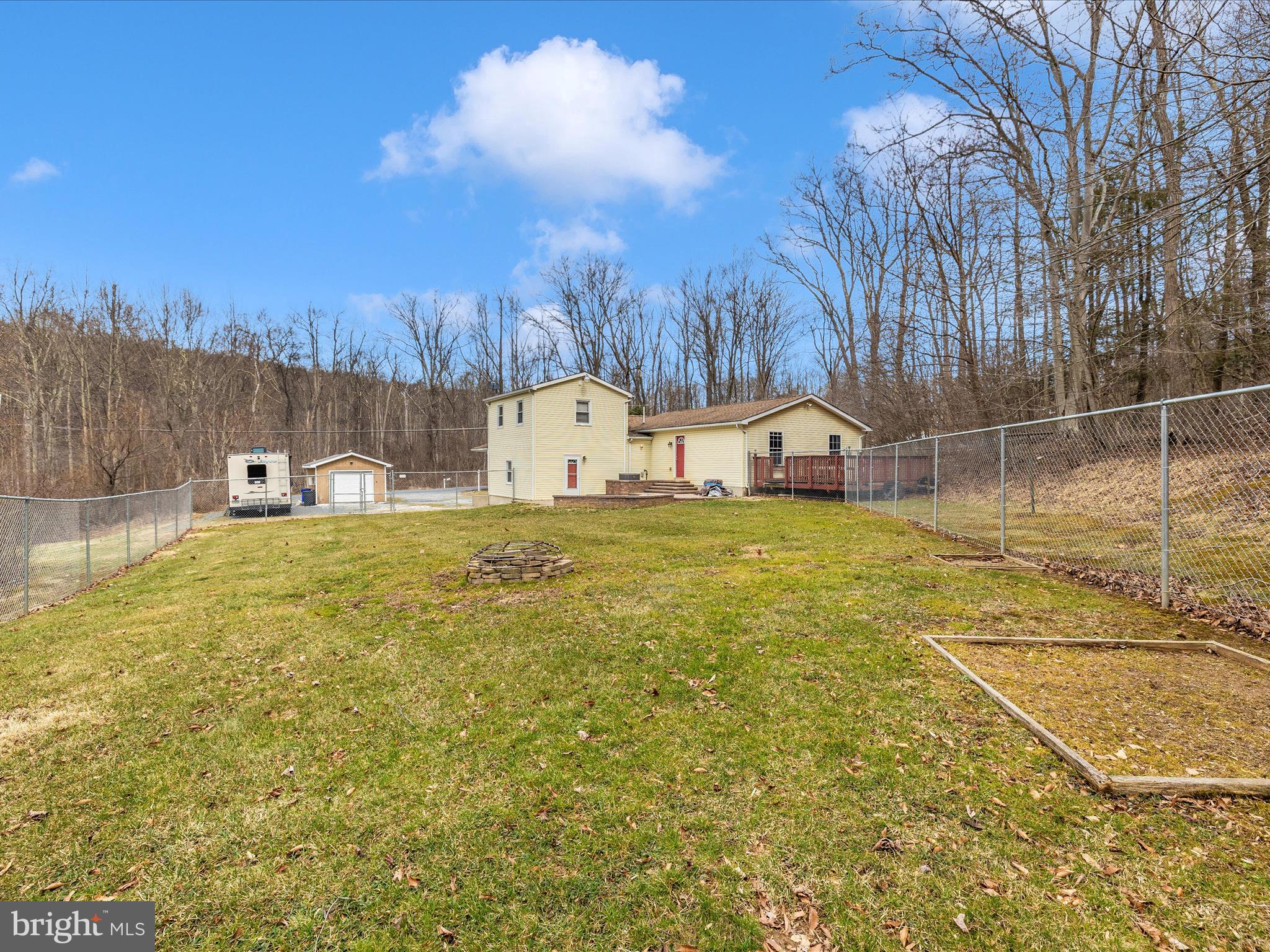 4439 John Draper Road Smithsburg, MD 21783 - Photo 57 of 63 a view of a swimming pool with an outdoor space and seating area
